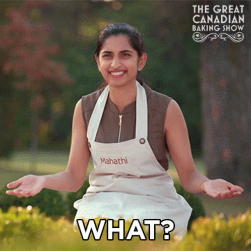 Woman In Apron Asking What GIF