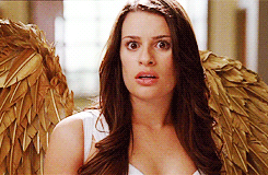 A Woman Wearing Angel Wings Looks Surprised And Shocked GIF