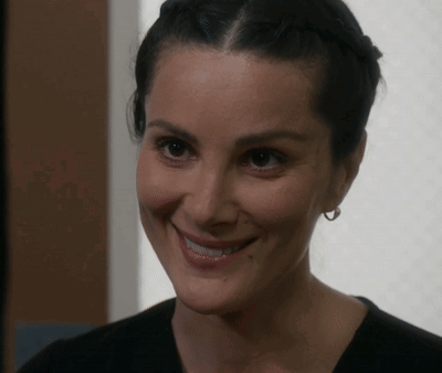 Woman Smiling With Earrings GIF