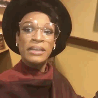 Woman Wearing Glasses Hat Making Funny Face GIF