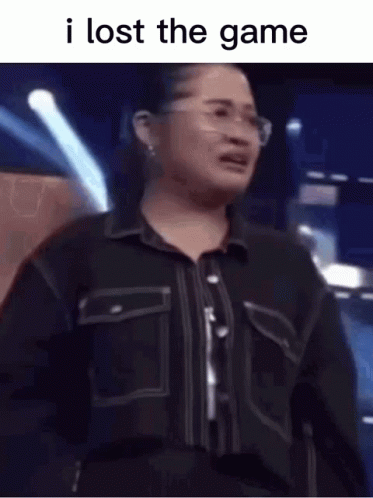A Woman Wearing Glasses And A Black Shirt Is Crying . GIF
