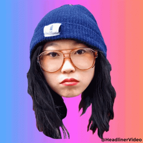 A Woman Wearing Glasses And A Blue Beanie Has A Headlinervideo Watermark GIF