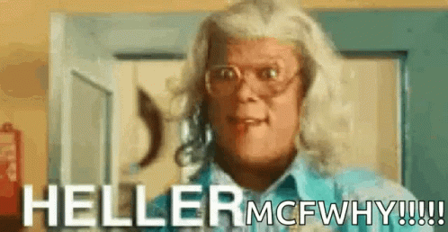 A Woman Wearing Glasses And A Blue Shirt Is Standing In Front Of A Door And Saying Heller Mcfwhy !!! GIF