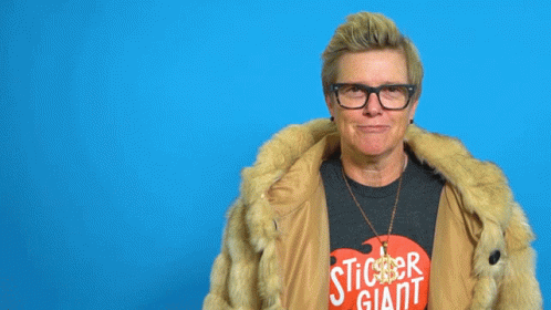 A Woman Wearing Glasses And A Fur Coat Has The Word Baller Written Above Her Head GIF