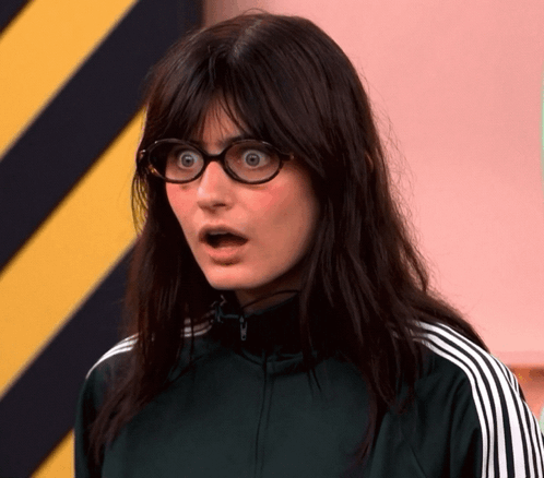 Woman With Glasses And Green Jacket Surprised GIF