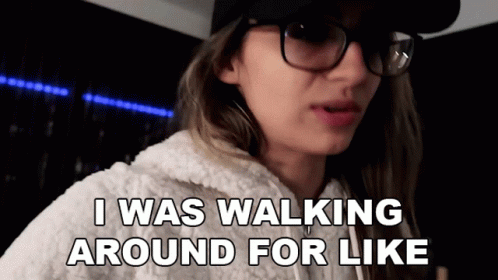 A Woman Wearing Glasses And A Hat Is Saying I Was Walking Around For Like . GIF