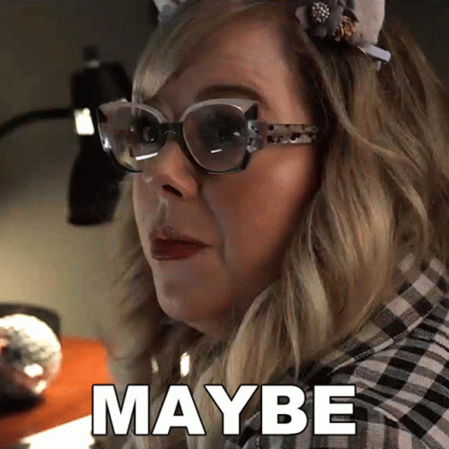 A Woman Wearing Glasses And A Headband Says Maybe GIF