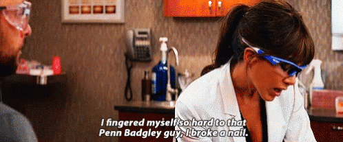 A Woman Wearing Glasses And A Lab Coat Is Talking To A Man In A Lab . GIF