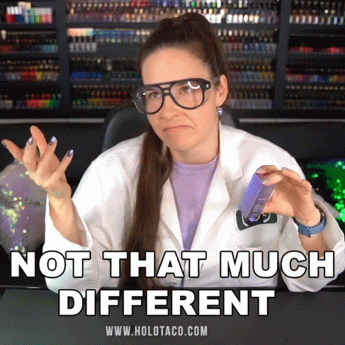 A Woman Wearing Glasses And A Lab Coat Says " Not That Much Different " While Holding Something GIF