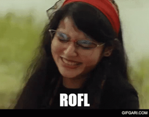 A Woman Wearing Glasses And A Red Headband Is Smiling And The Word Rofl Is Written On The Screen . GIF