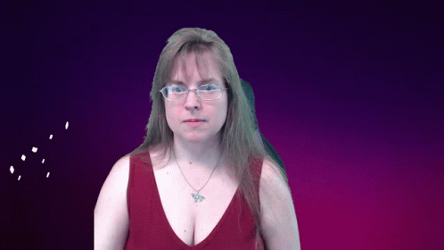 a woman wearing glasses and a red tank top has a butterfly necklace
