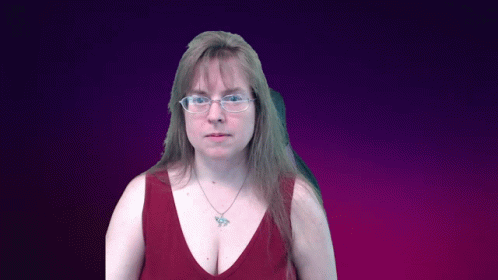 a woman wearing glasses and a red tank top with a butterfly necklace