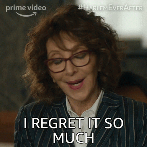 A Woman Wearing Glasses And A Striped Suit Says I Regret It So Much GIF