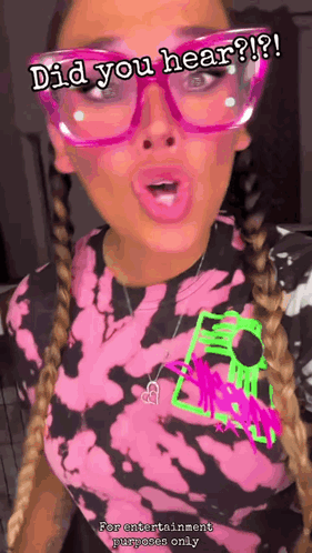 A Woman Wearing Glasses And A Tie Dye Shirt With The Words Did You Hear GIF