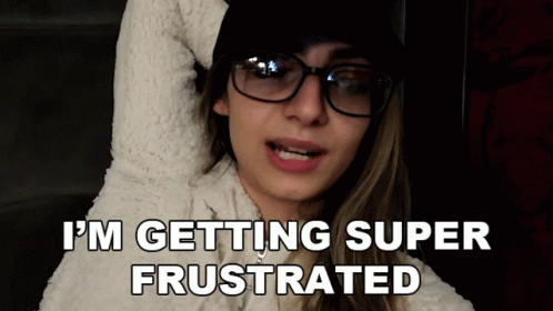 A Woman Wearing Glasses And A White Sweater Says I 'M Getting Super Frustrated GIF