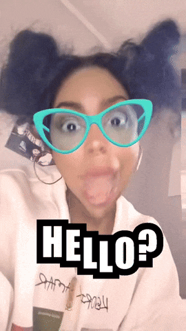 A Woman Wearing Glasses And A White Sweatshirt With The Word Hello On It GIF