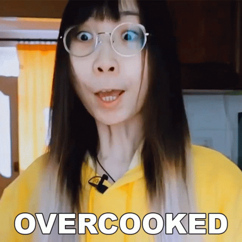 A Woman Wearing Glasses And A Yellow Hoodie Has The Word Overcooked Above Her Head GIF