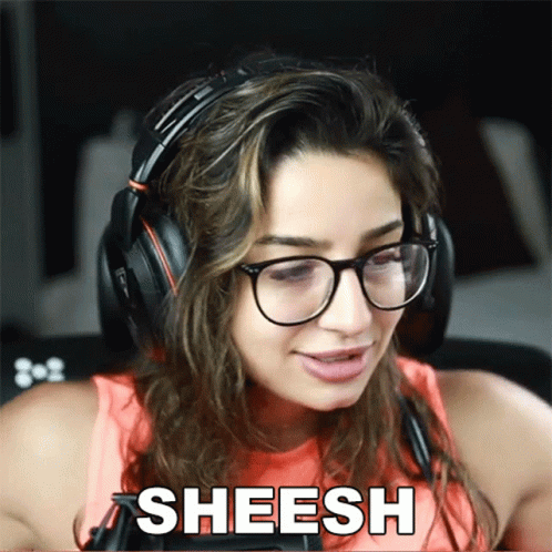 A Woman Wearing Glasses And Headphones Has The Word Sheesh Above Her Head GIF