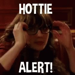 A Woman Wearing Glasses Is Covering Her Ears With Her Hands And The Words `` Hottie Alert ! '' GIF