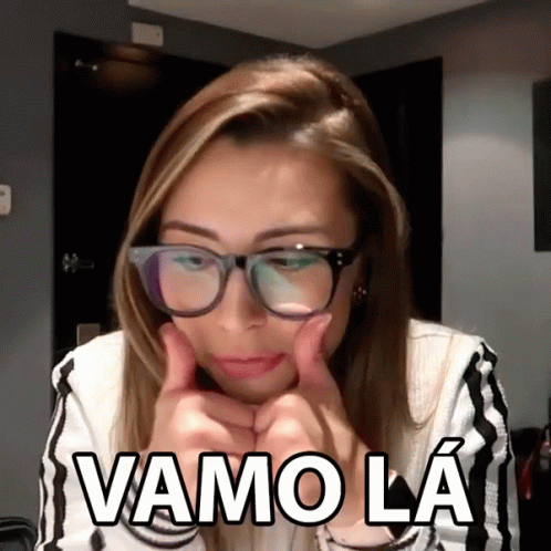 A Woman Wearing Glasses Is Giving A Thumbs Up And Says Vamo La In White Letters GIF