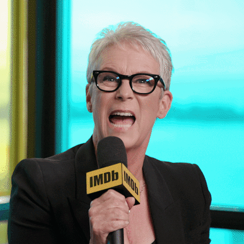 Woman With Glasses Holding IMDb Microphone GIF