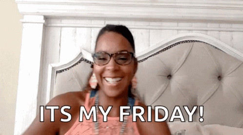 a woman wearing glasses is laying on a bed with the words " it 's my friday " above her