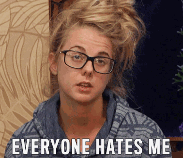 A Woman Wearing Glasses Is Making A Funny Face And Says Everyone Hates Me GIF