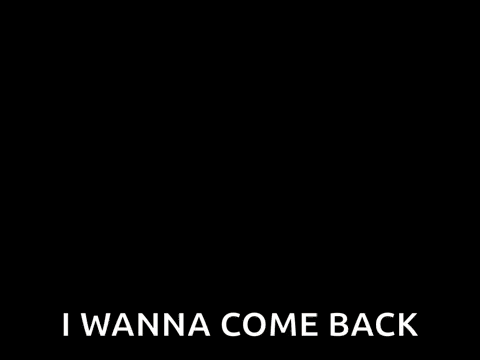 A Woman Wearing Glasses Is Sitting At A Table And Saying `` Surprise ! I Wanna Come Back '' . GIF