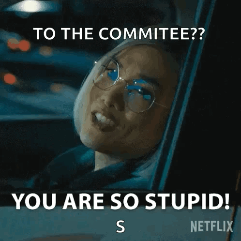 A Woman Wearing Glasses Is Sitting In A Car And Says `` To The Committee ? You Are So Stupid ! S '' GIF