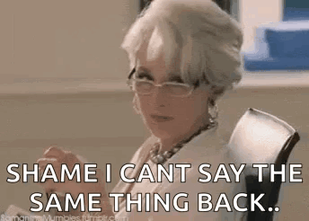 A Woman Wearing Glasses Is Sitting In A Chair And Saying `` Shame I Can 'T Say The Same Thing Back ... '' GIF