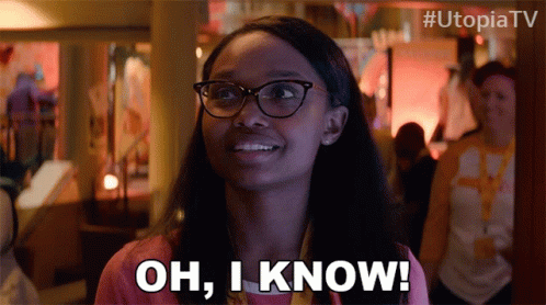A Woman Wearing Glasses Is Smiling And Says Oh I Know GIF