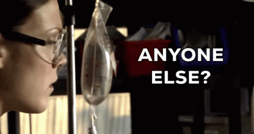 Woman With Glasses Looking At Liquid Bag 'Anyone Else GIF