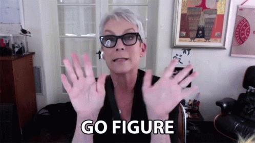 A Woman Wearing Glasses Says Go Figure With Her Hands In The Air GIF