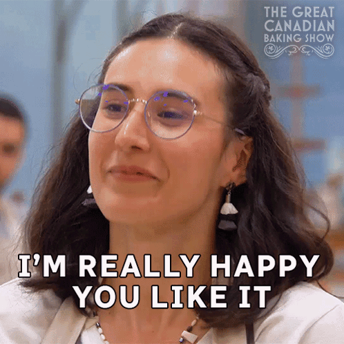 A Woman Wearing Glasses Says I 'M Really Happy You Like It . GIF