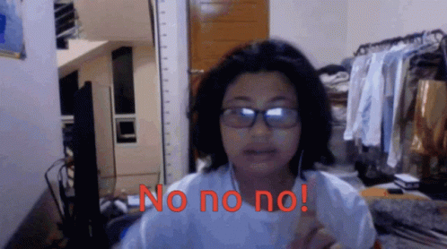 A Woman Wearing Glasses Says No No No In Red GIF