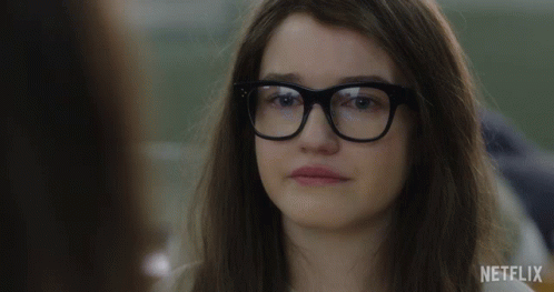 A Woman Wearing Glasses Says " This Is Really Happening " In A Netflix Ad GIF
