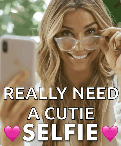 A Woman Wearing Glasses Takes A Selfie With The Words Really Need A Cutie Selfie GIF