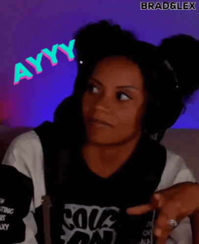 A Woman Wearing Headphones And A Black Shirt Is Making A Funny Face . GIF