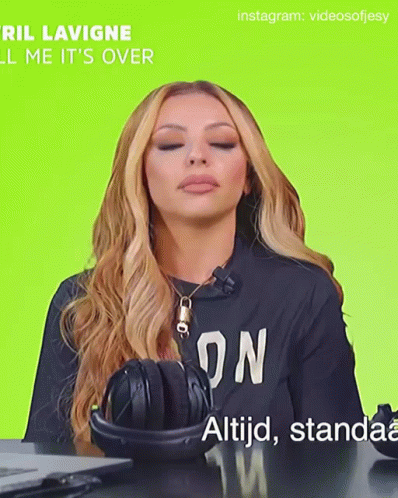 A Woman Wearing Headphones And A Black Shirt That Says ' On ' On It GIF