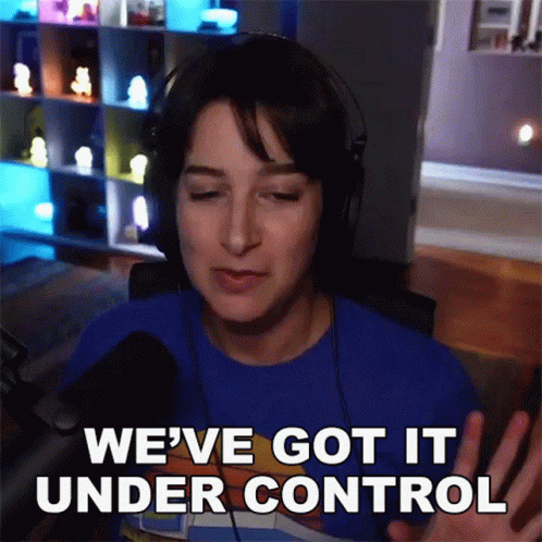 A Woman Wearing Headphones And A Blue Shirt Says " We 'Ve Got It Under Control " GIF