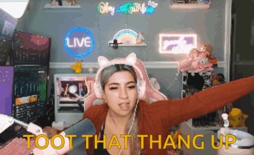 A Woman Wearing Headphones And A Cat Headband Says " Toot That Thang Up " GIF