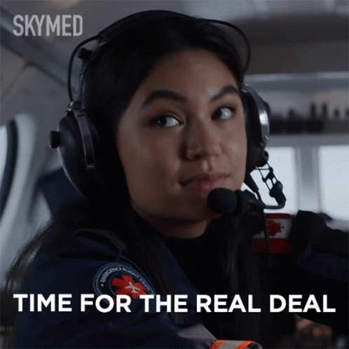 A Woman Wearing Headphones And A Headset Says Time For The Real Deal GIF