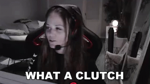 A Woman Wearing Headphones And A Microphone Is Sitting In A Chair In Front Of A Computer . GIF