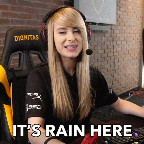 A Woman Wearing Headphones And A Shirt That Says Dignitas Sits In Front Of A Keyboard GIF