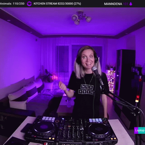A Woman Wearing Headphones And A Tshirt That Says Tech House GIF