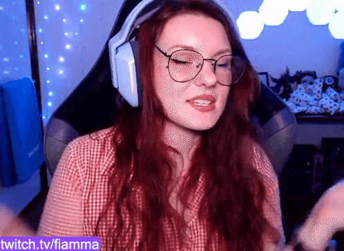 A Woman Wearing Headphones And Glasses Is On Twitch.tv/fiamma GIF