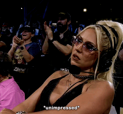 A Woman Wearing Headphones And Sunglasses Says Unimpressed GIF
