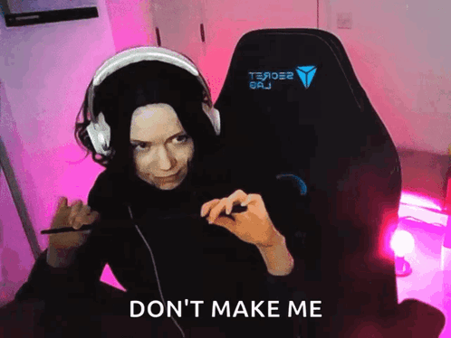 a woman wearing headphones is sitting in a chair with the words " do n't make me " written on the bottom