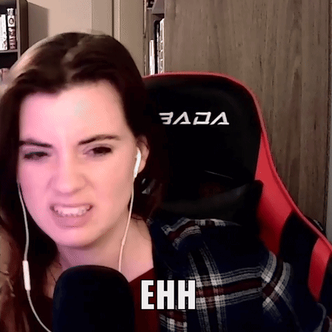 A Woman Wearing Headphones Is Sitting In A Red And Black Gaming Chair With The Word Ehhh Written On It GIF