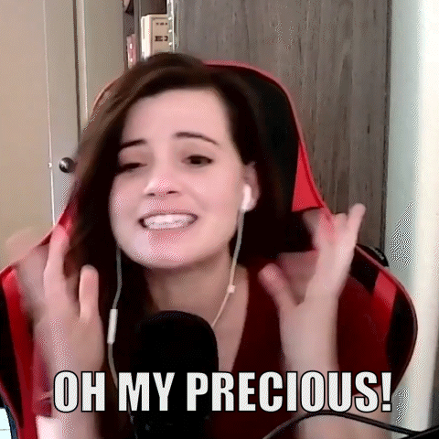 A Woman Wearing Headphones Is Sitting In Front Of A Microphone And Says Oh My Precious ! GIF